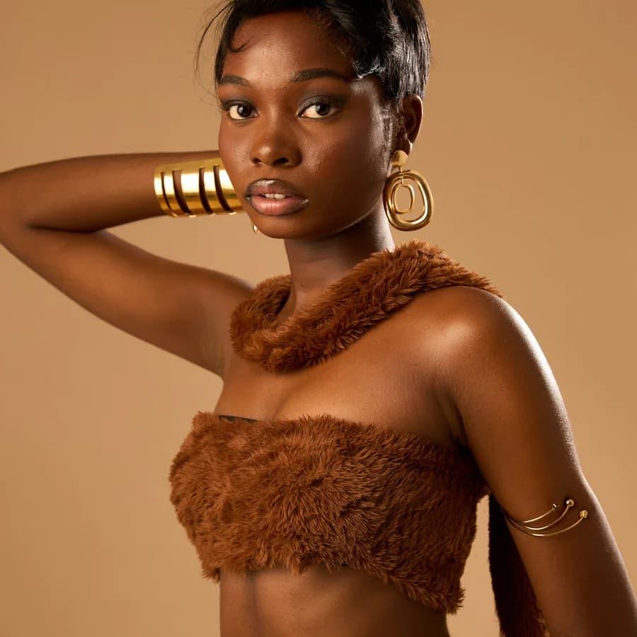 Gold cuff bracelets and hoop earrings